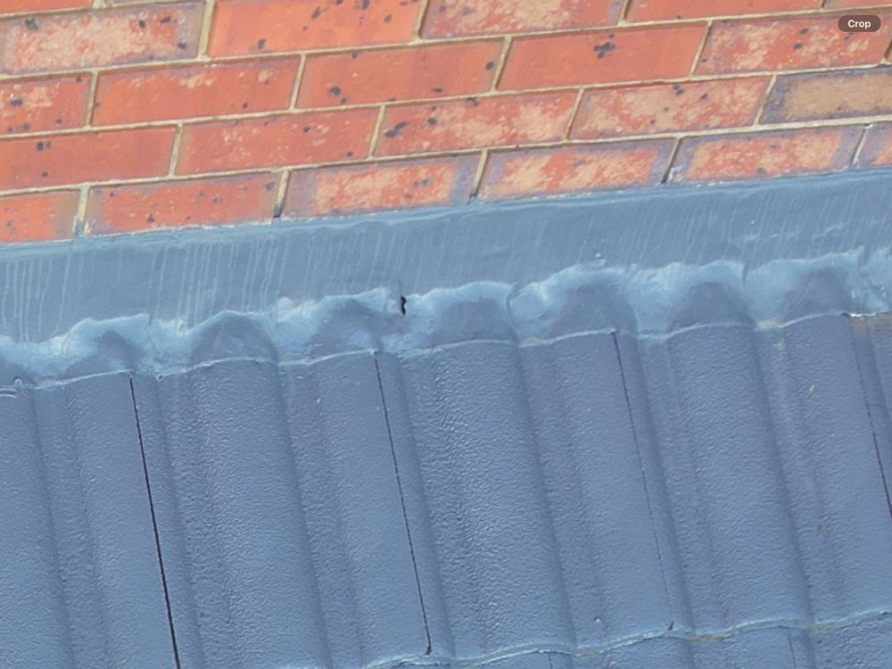 Gaps along the roof flashing that let wind driven rain past it, found during a defect investigation inspection in Aspendale Gardens